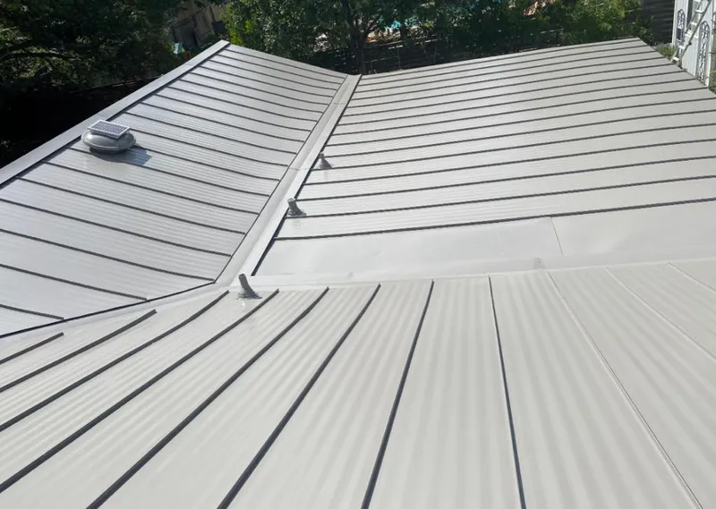 Solar attic fan installed on a metal roof for Roof Ventilation in Sutherlin